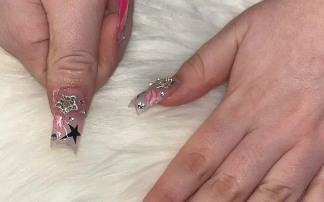 An XL set by Jade, pink and black freestyle with stars and a rhinestone accent