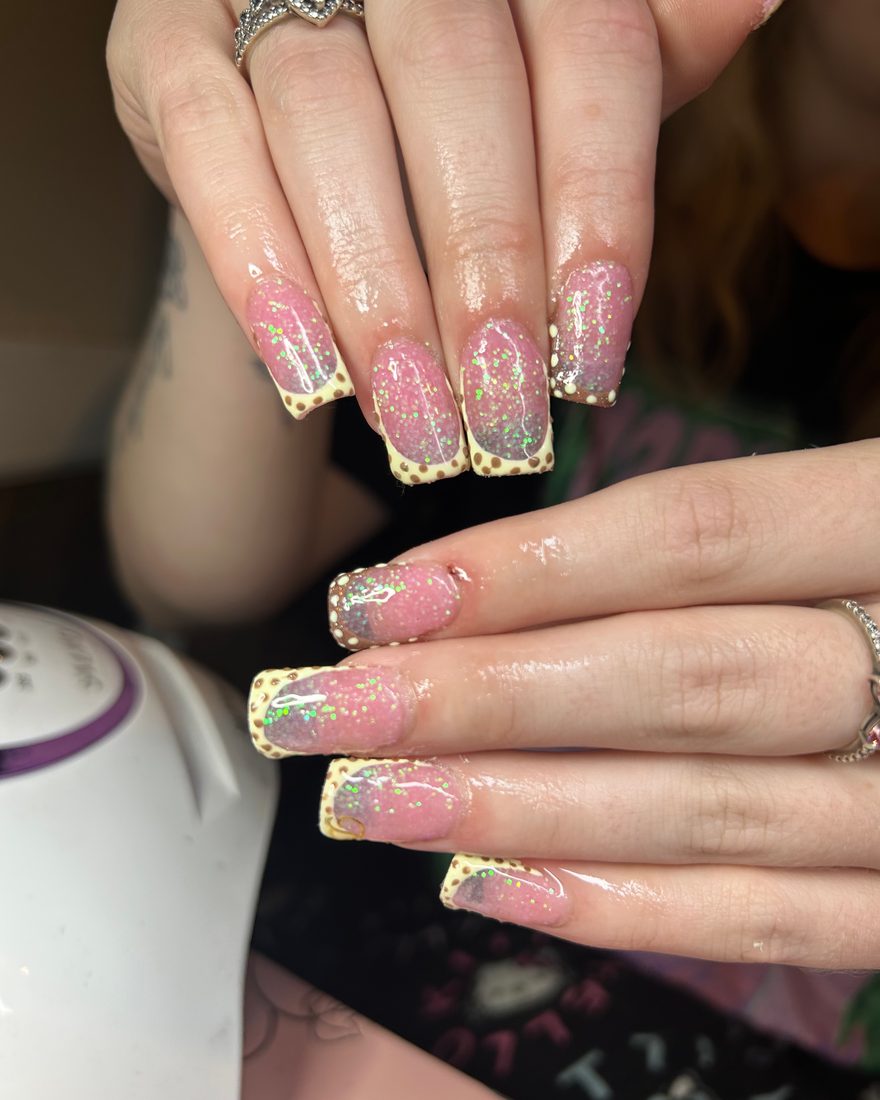 Long square set with a pink glitter base and yellow leopard print french tips
